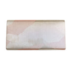 Reverse view of vintage Japanese silk fold over clutch bag in silver with geometric pattern on white. 