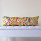 Silver and yellow silk kimono bolster cushion with multicoloured open fans motifs in a neutral room