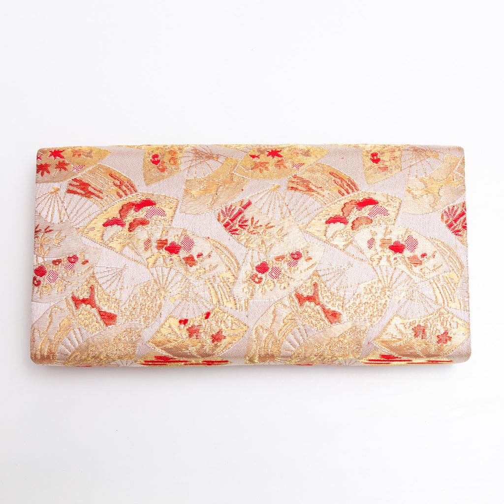 Back view of gold vintage Japanese silk clutch bag with small fan and flower pattern