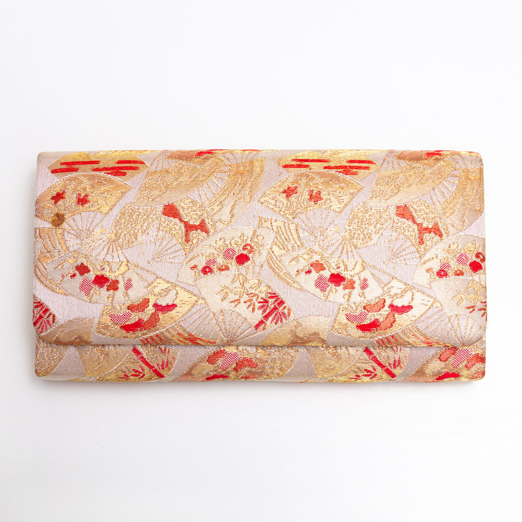 Front view of gold red kimono silk clutch bag with all-over fan pattern