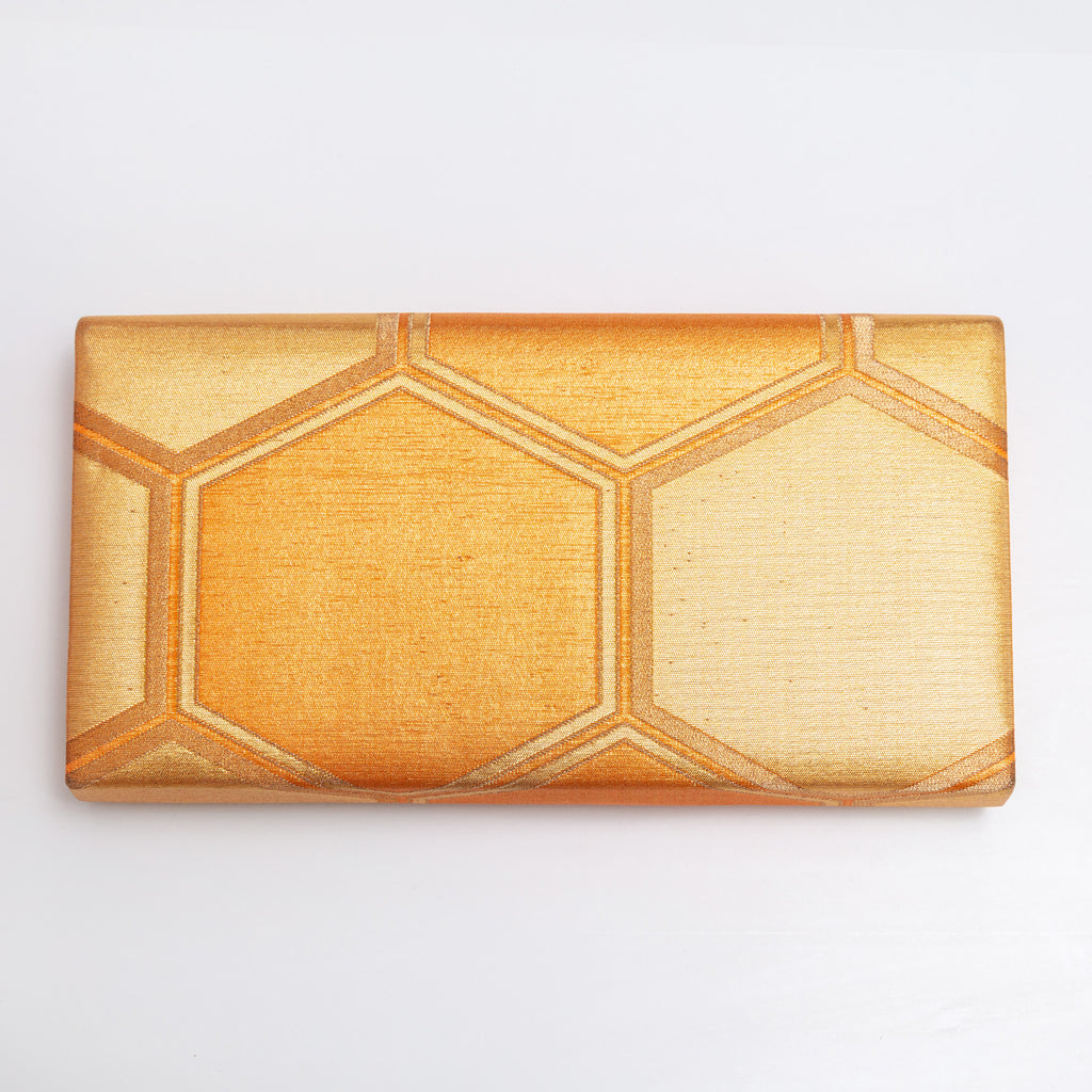Back view of gold vintage Japanese silk clutch bag with metallic woven hexagon texture