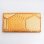 Back view of gold vintage Japanese silk clutch bag with metallic woven hexagon texture