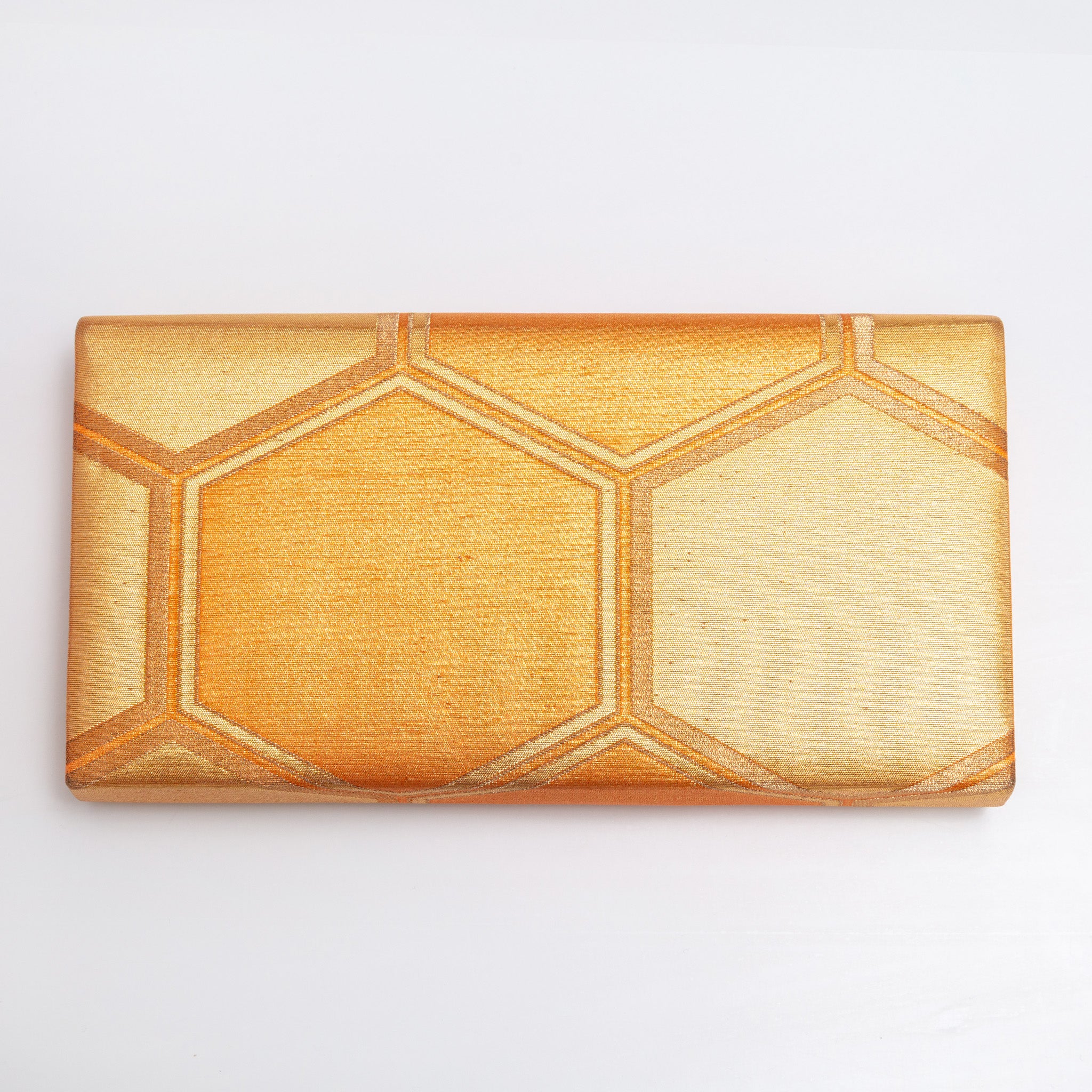 Back view of gold vintage Japanese silk clutch bag with metallic woven hexagon texture