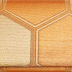 Close-up of oversized Kikkō hexagons woven into metallic gold kimono silk
