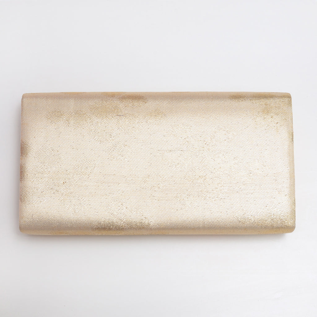 Back view of gold vintage Japanese silk clutch bag with subtle mottled metallic pattern