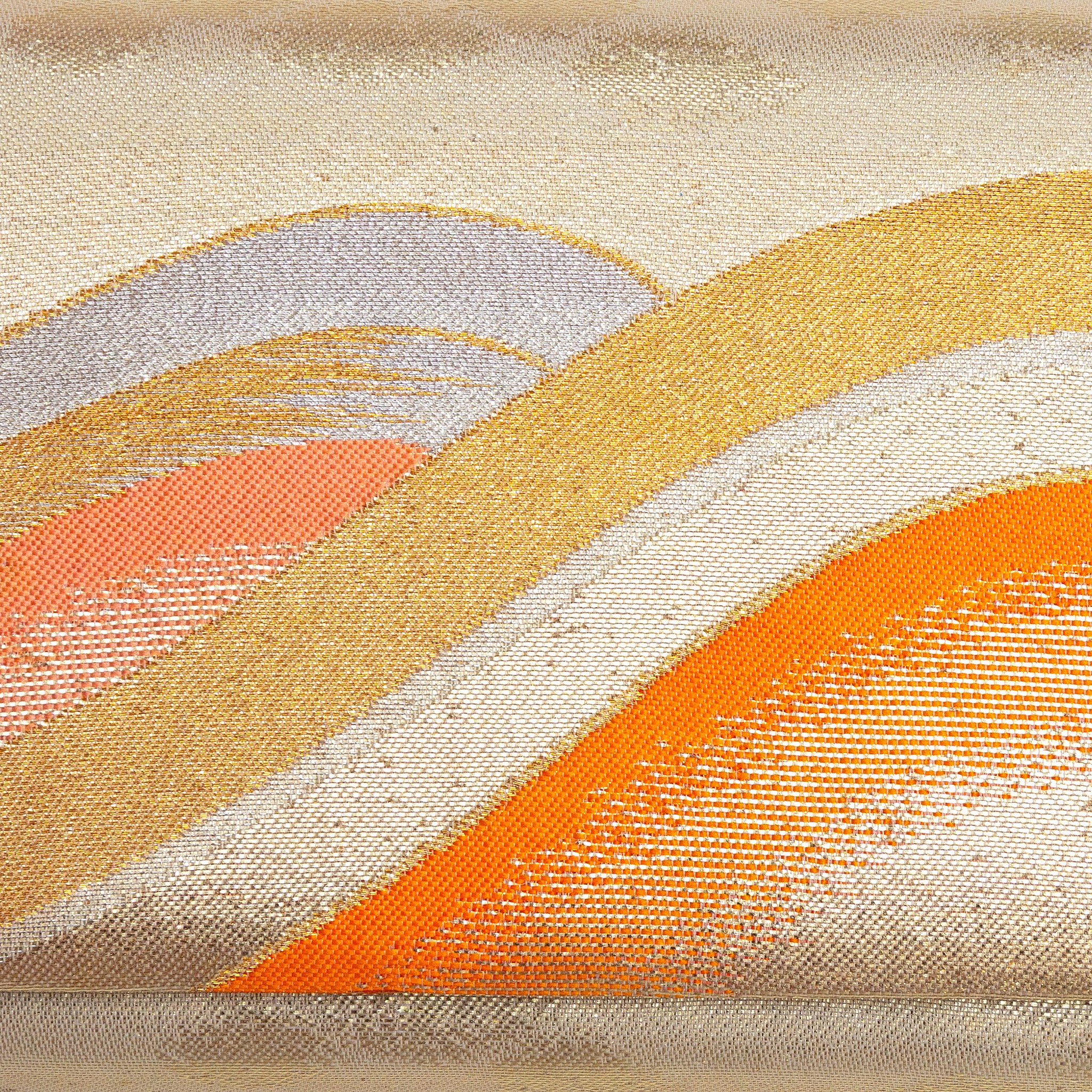 Close-up of layered orange, gold and cream wave design woven into kimono silk