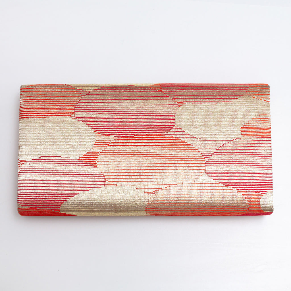 Back view of red and gold vintage Japanese silk clutch bag with abstract cloud pattern