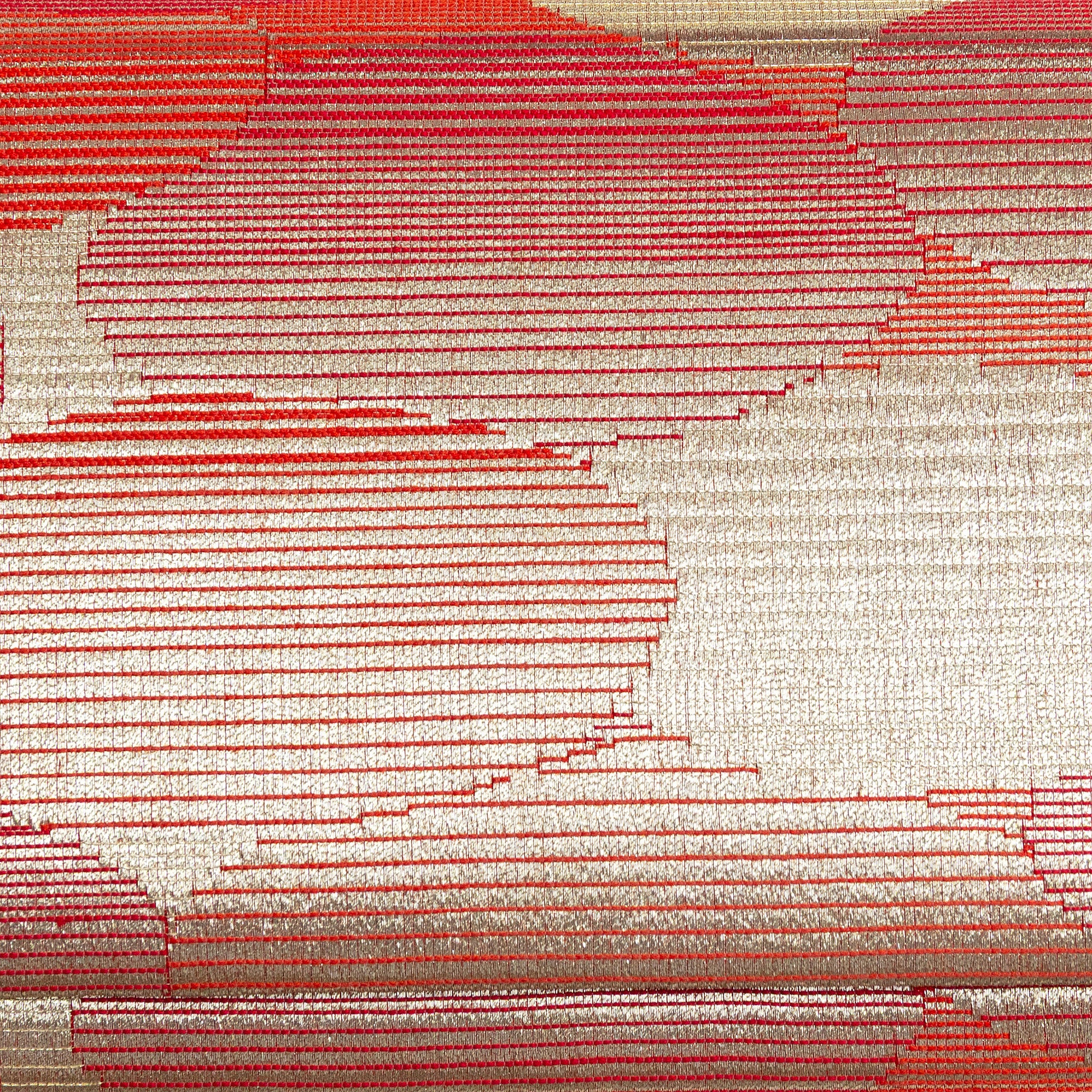 Close-up of red-gold abstract cloud design woven into vintage kimono silk