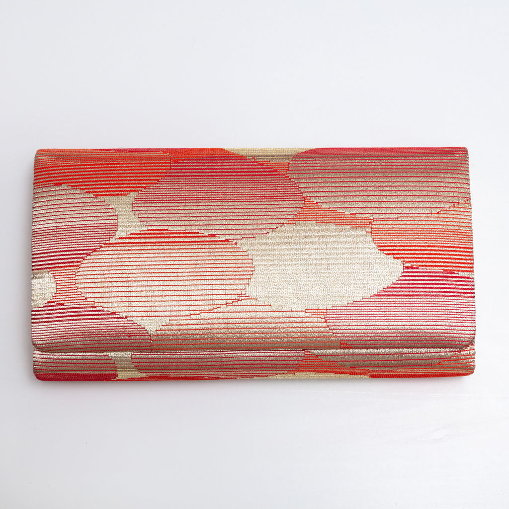 Front view of red-gold kimono silk clutch bag with abstract cloud pattern