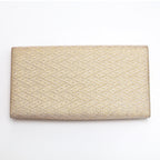 Back view of gold kimono silk clutch bag with woven diamond geometric texture
