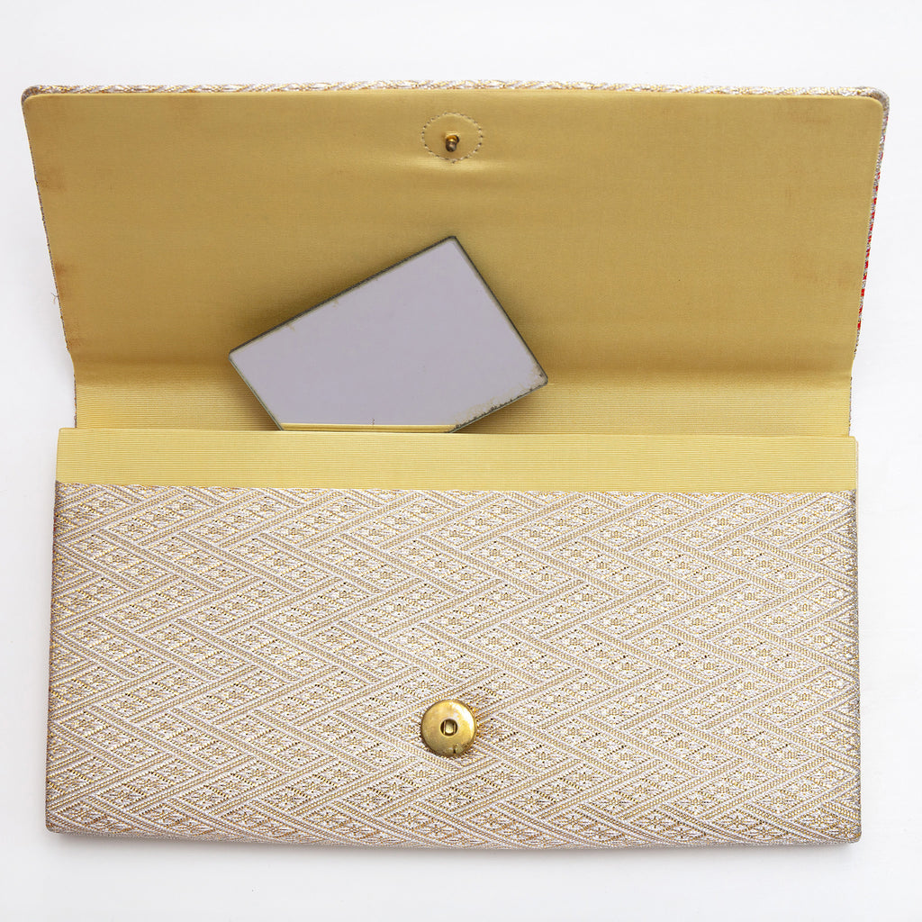 Gold kimono silk clutch bag open with original mirror inside