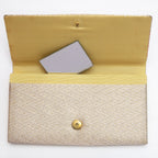 Gold kimono silk clutch bag open with original mirror inside