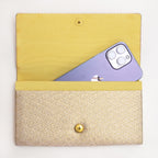 Vintage Japanese clutch bag shown with iPhone for scale inside the silk interior