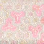 Close-up of intricate pink and white beadwork detailing the clutch’s textured surface and bishamonten kikko geometric pattern