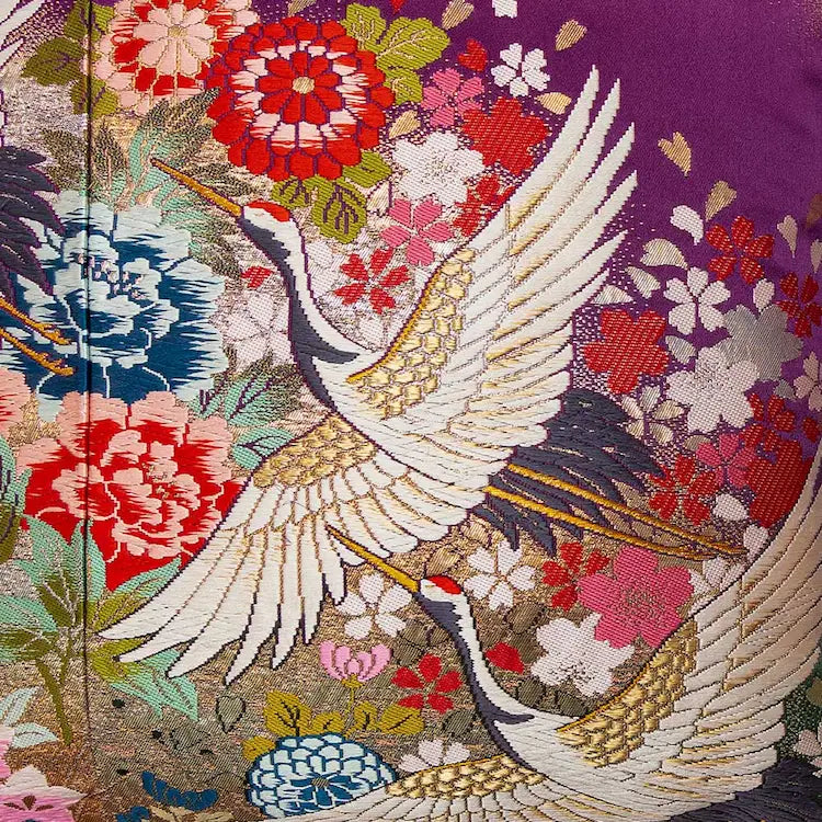 Japanese crane embroidery on vintage kimono cushion - traditional silk obi pillow with symbolic design
