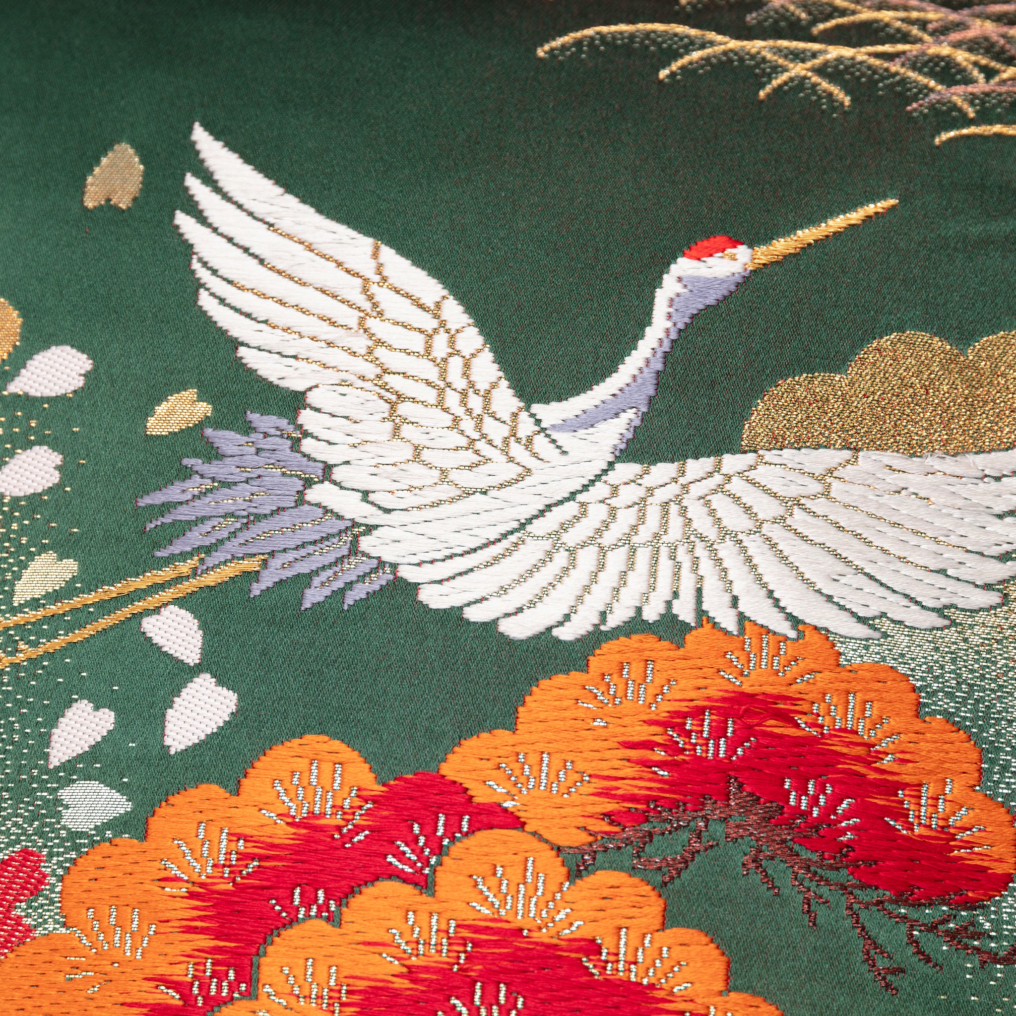 Close-up of green silk fabric and gold velvet weave detail on the Oriental Cushion pair, highlighting luxurious textures and