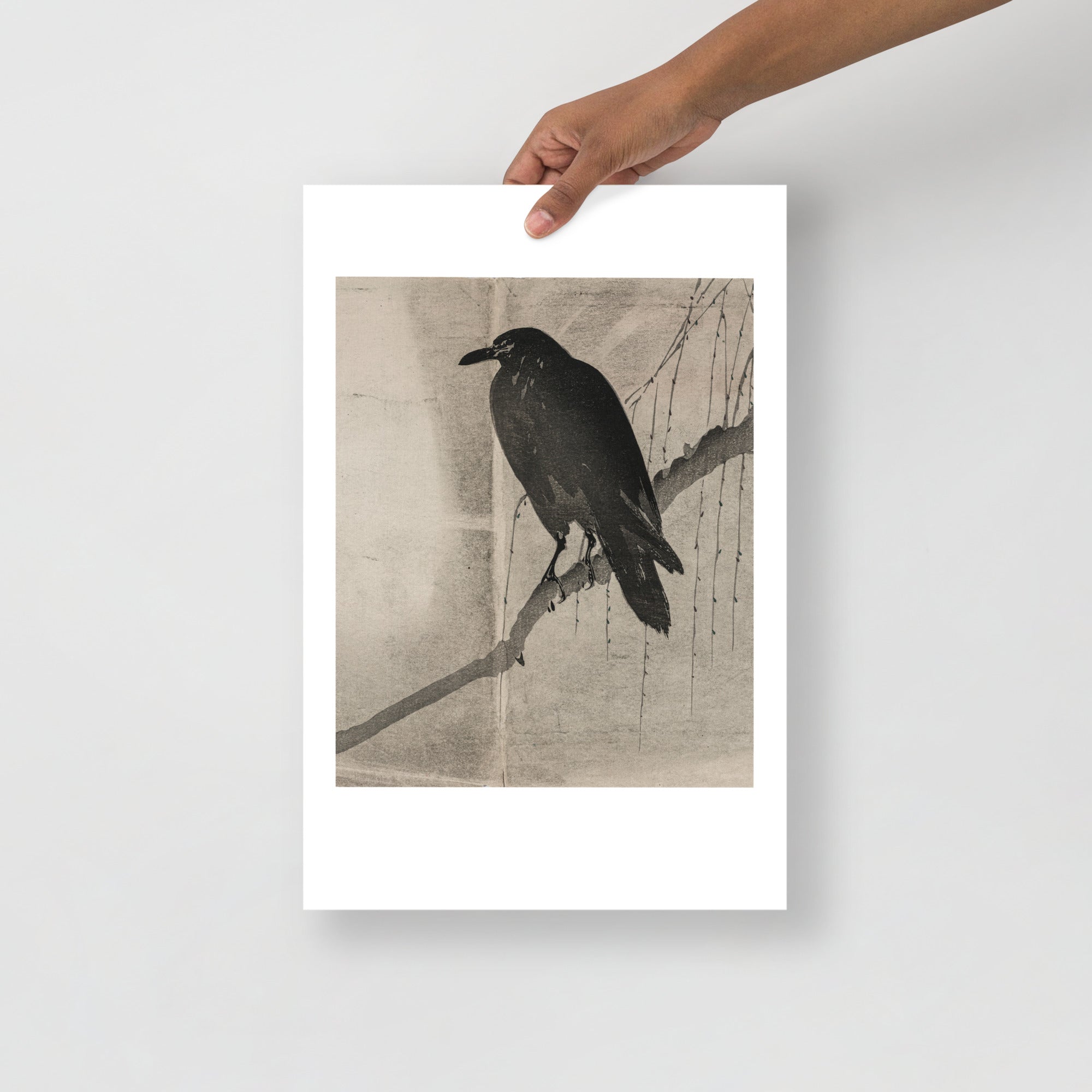 Detail of the Japanese crow's intricate feather pattern and subtle ink shading from the 1860s print, showcasing precise