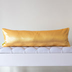 Plain gold silk reverse of long kimono bolster cushion on white bench