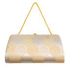 Gold and silver geometric patterned vintage Japanese silk clutch bag with a gold chain strap on a white background