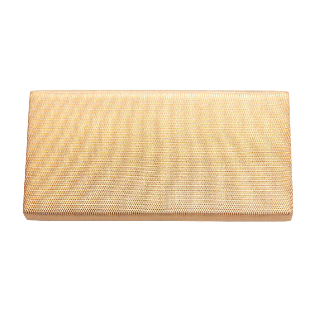 Reverse view of a vintage gold silk Japanese clutch bag on a white background.
