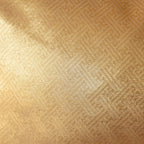 Close-up of a gold textured silk obi cushion reverse surface with a geometric pattern
