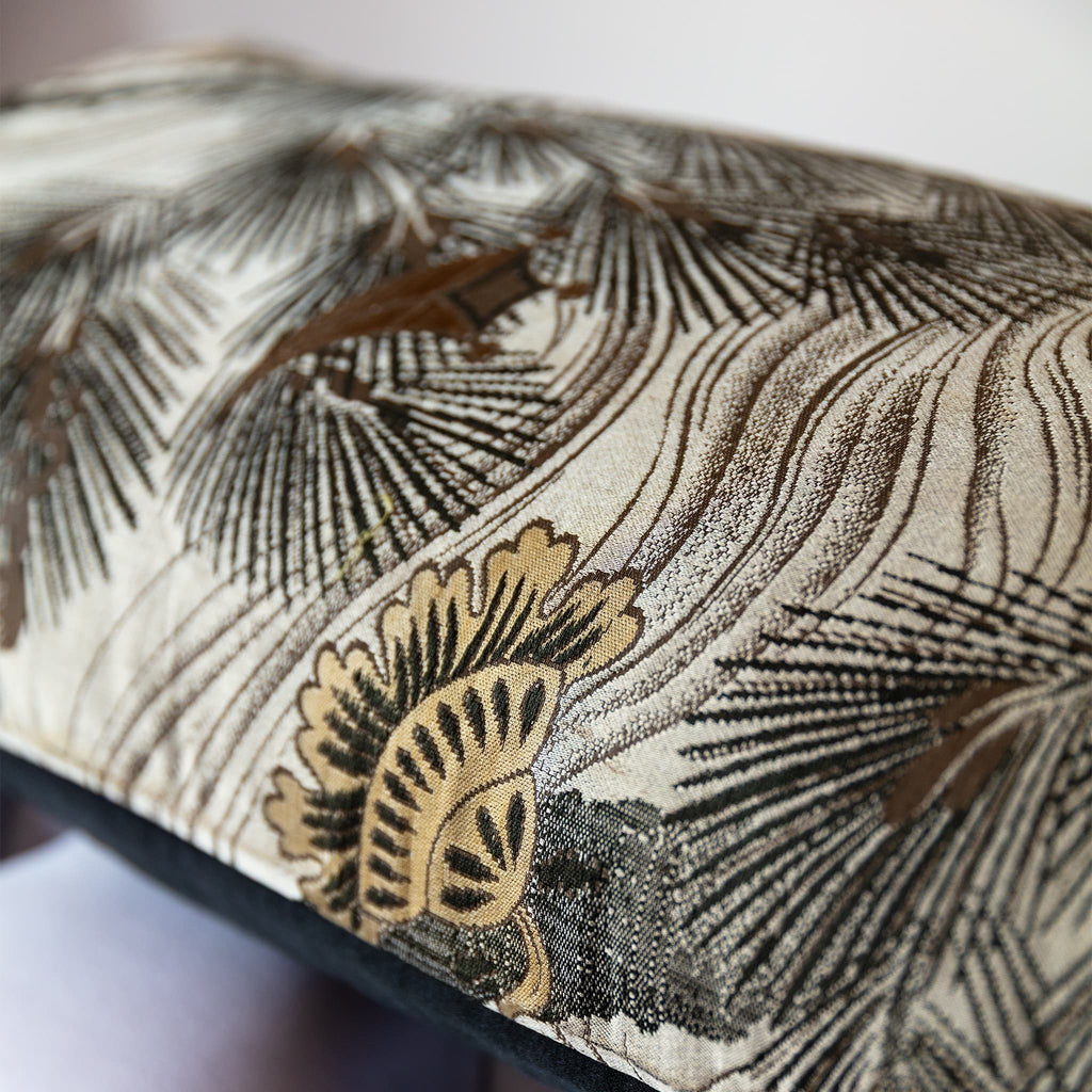 Close-up of woven pine tree motif on vintage grey Japanese Maru Obi silk bolster cushion