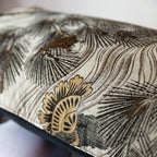 Close-up of woven pine tree motif on vintage grey Japanese Maru Obi silk bolster cushion