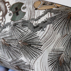 Silk weave detail of pine and wave pattern on grey vintage Maru Obi bolster cushion