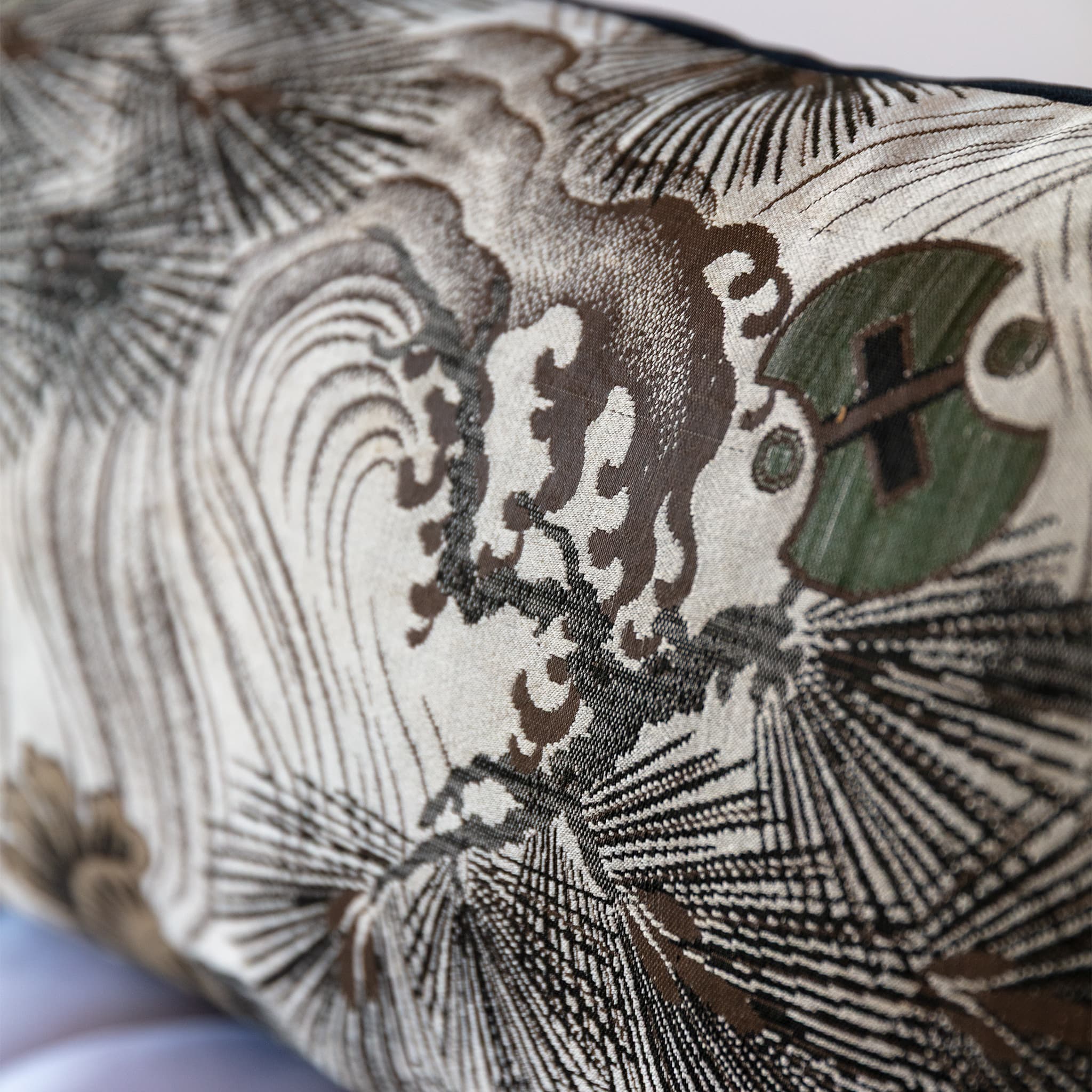 Close-up of wild wave motif woven on grey vintage Japanese Maru Obi silk bolster cushion