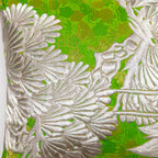 close up of vintage uchikake kimono silk bolster showing silver pine embroidery over green brocade