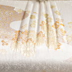 Close-up of the Ivory Silk Clutch's intricate kimono silk embroidery showcasing delicate floral patterns and subtle sheen