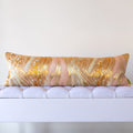 Long gold silk bolster cushion made from vintage Japanese obi with araumi wave motif in gold and silver on a soft pink ground