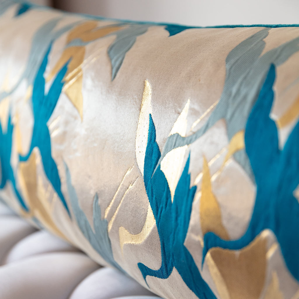Teal crane motif close-up on vintage Japanese Fukuro Obi silk bolster cushion, stylised mid-century bird design