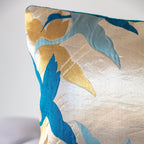 Stylised teal crane silhouettes woven on pale gold vintage Japanese Fukuro Obi silk, mid-Shōwa period