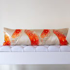 Long silver silk bolster cushion with spider chrysanthemums in flame and burnt orange on vintage Japanese Fukuro Obi silk