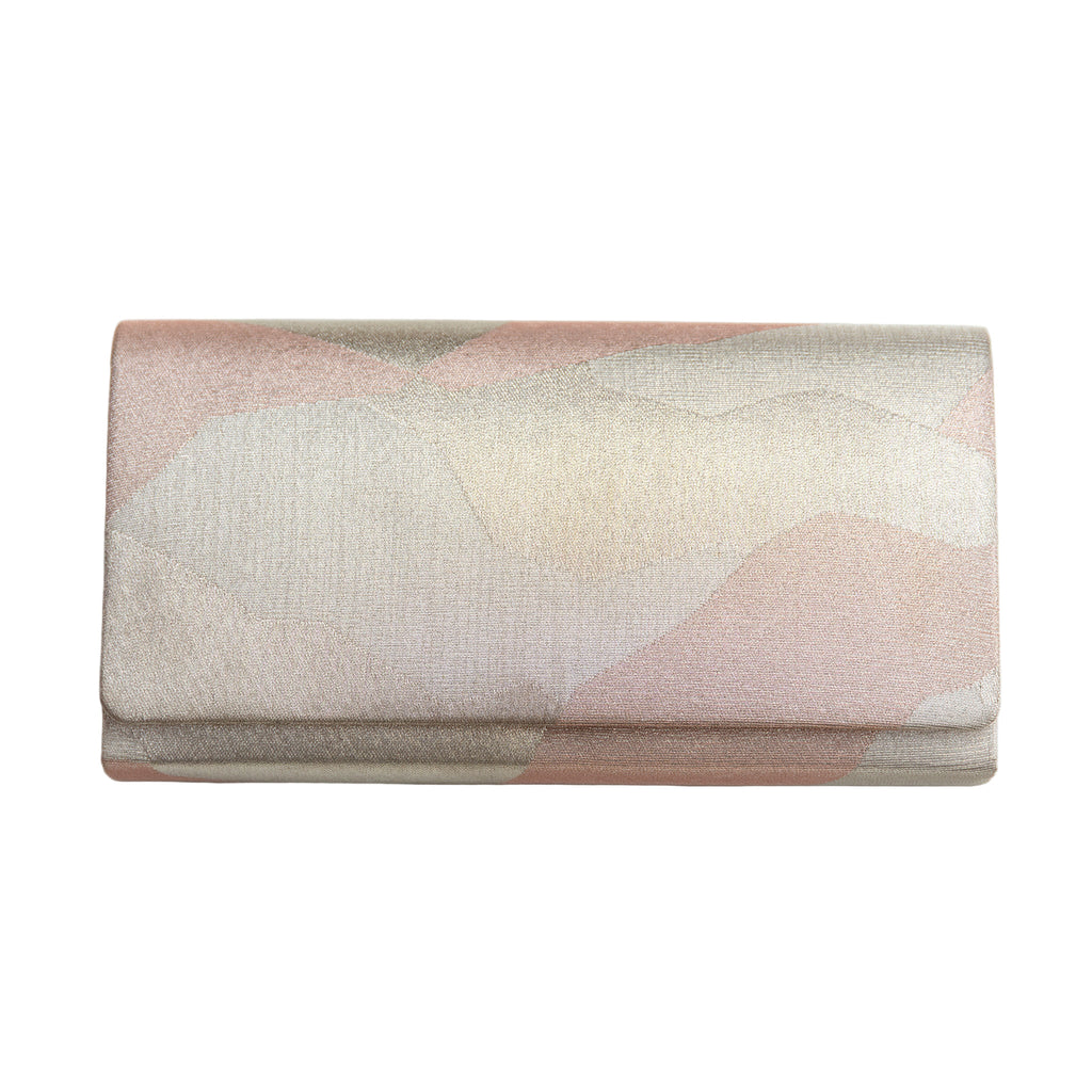 Vintage Japanese silk fold over clutch bag with abstract metallic pattern in silver and pale pink silk. On white background.
