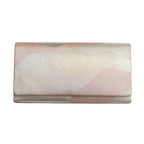 Vintage Japanese silk fold over clutch bag with abstract metallic pattern in silver and pale pink silk. On white background.