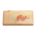 Vintage Japanese silk clutch bag in gold with fans motifs on a white background.