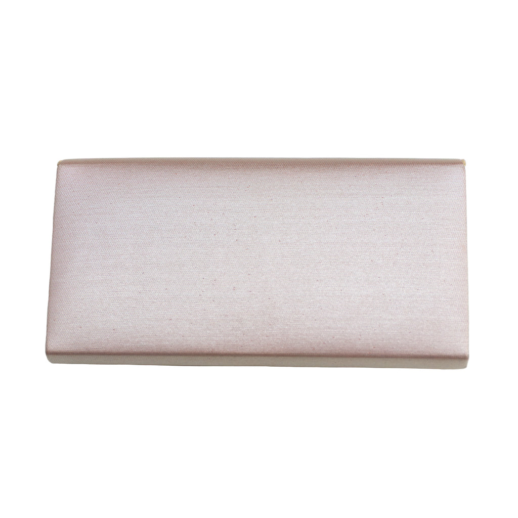 Reverse view of a vintage Japanese silk clutch bag on white background.