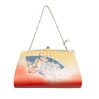 Vintage 1950's Japanese silk clutch bag in orange and yellow with peacock and fan motifs, silver chain strap, on white
