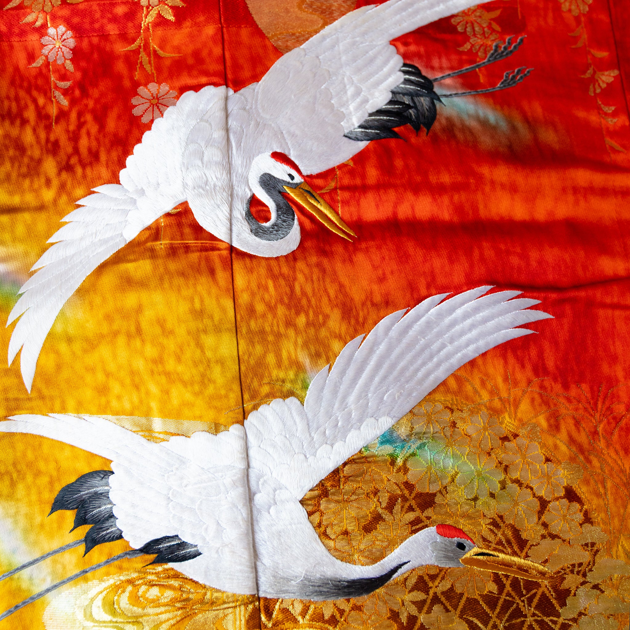 white silk embroidered cranes on kimono silk throw in red and gold