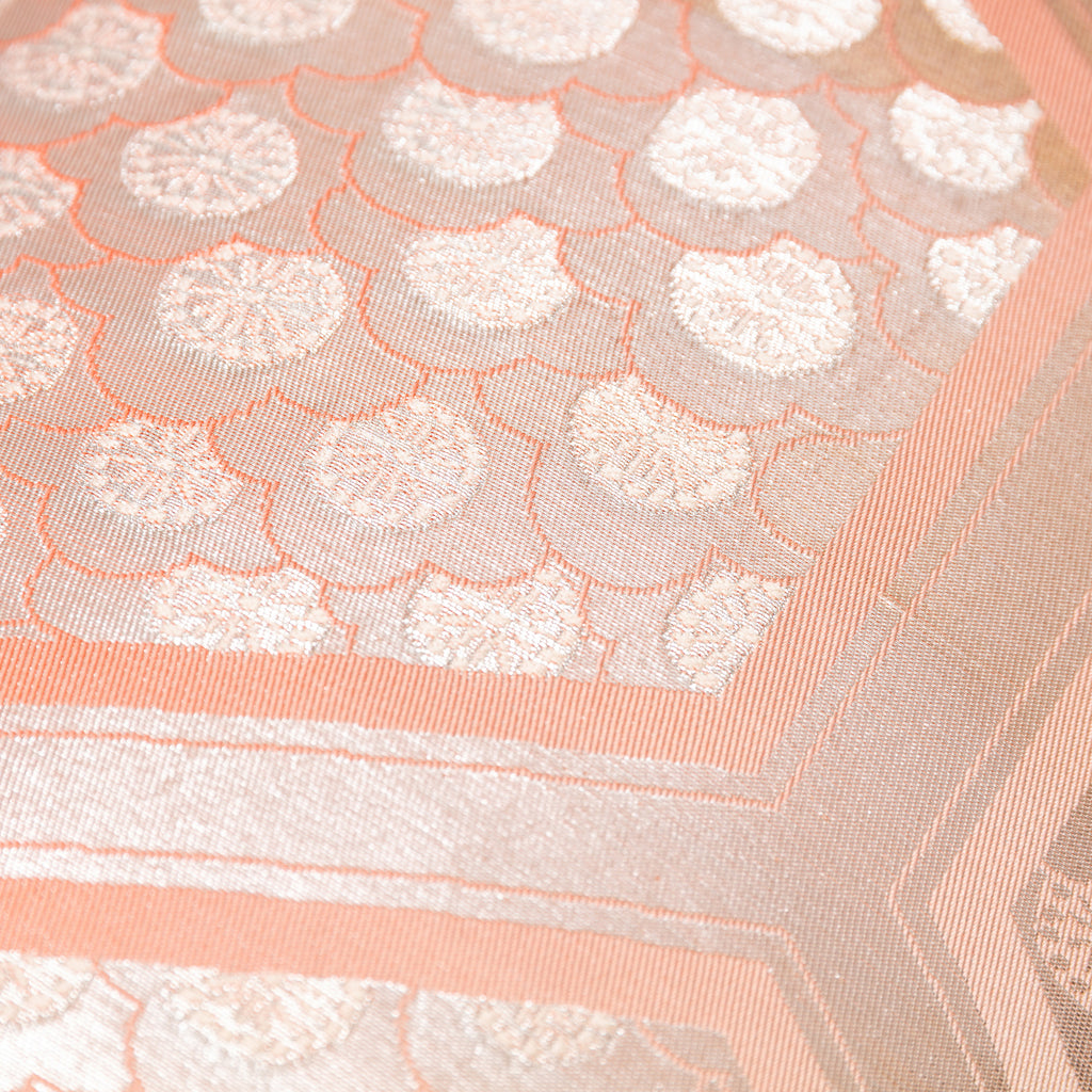Close-up of the Peach Cream Kimono Bolster Pillow’s Oyster back, highlighting smooth fabric texture and subtle sheen detail.