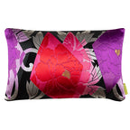 A rectangular silk accent pillow with a floral design in pink, silver, and purple on a black background. Repurposed vintage Japanese obi pillow by Kimono Living.