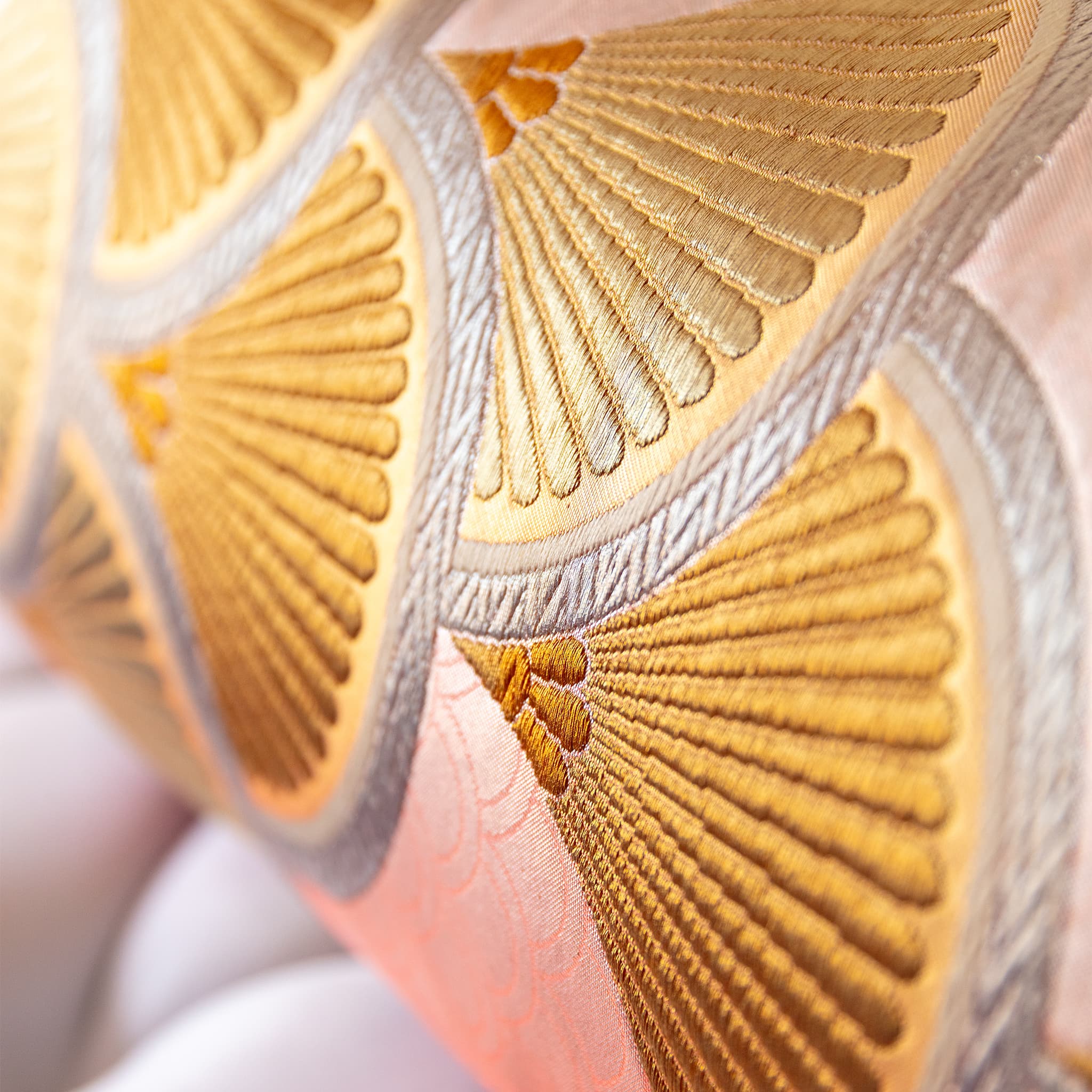 Close-up of gold fan motif with real gilt thread on pink vintage fukuro obi silk