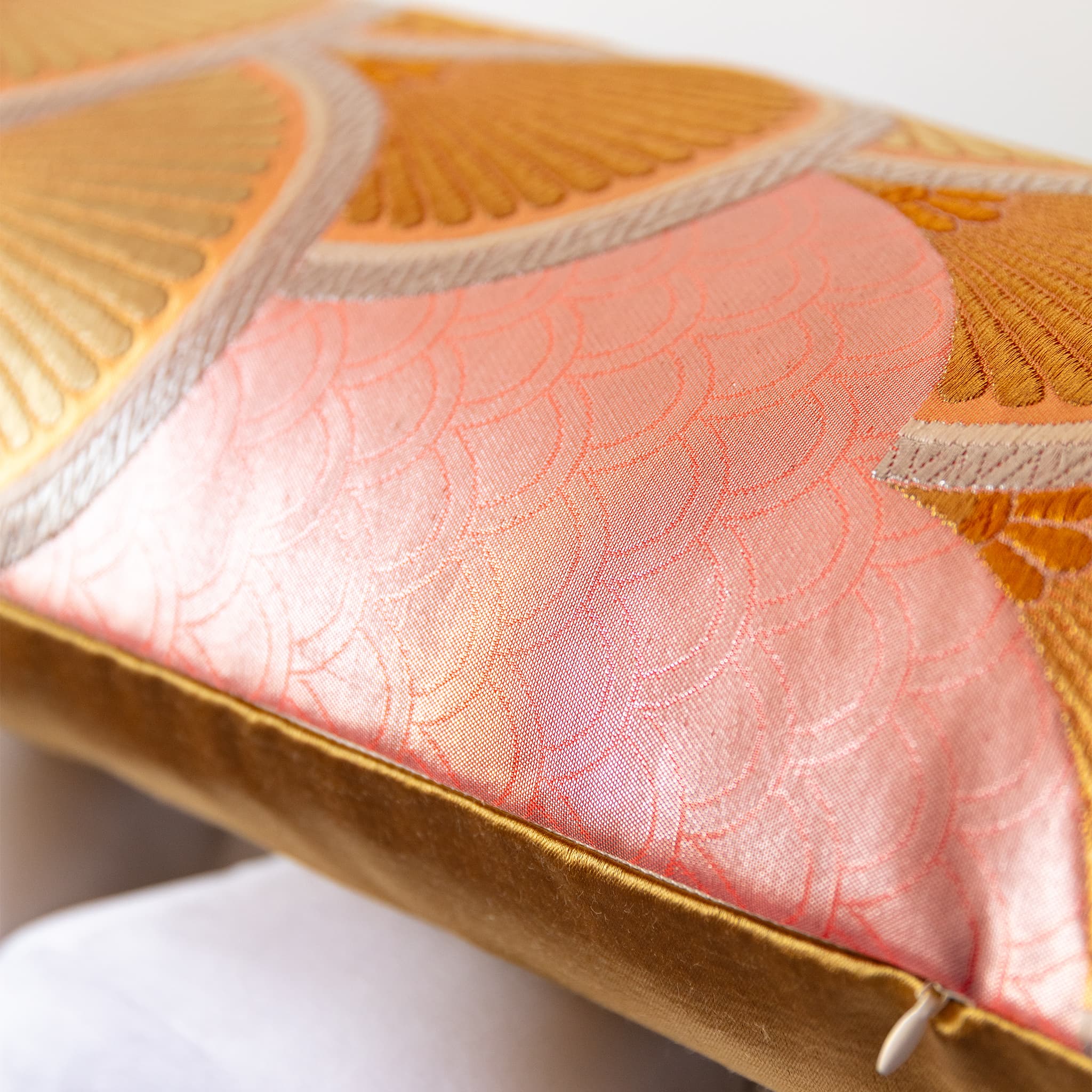 Close-up of gold fan motifs on pink woven seigaiha circles vintage Japanese fukuro obi silk