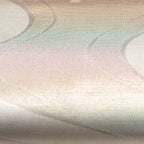 Close up view of vintage kimono silk bag woven multicoloured metallic silk in river pattern with silver edges.