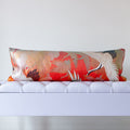 long bolster cushion made from vintage uchikake kimono silk in red with white cranes and silver clouds on a white bench