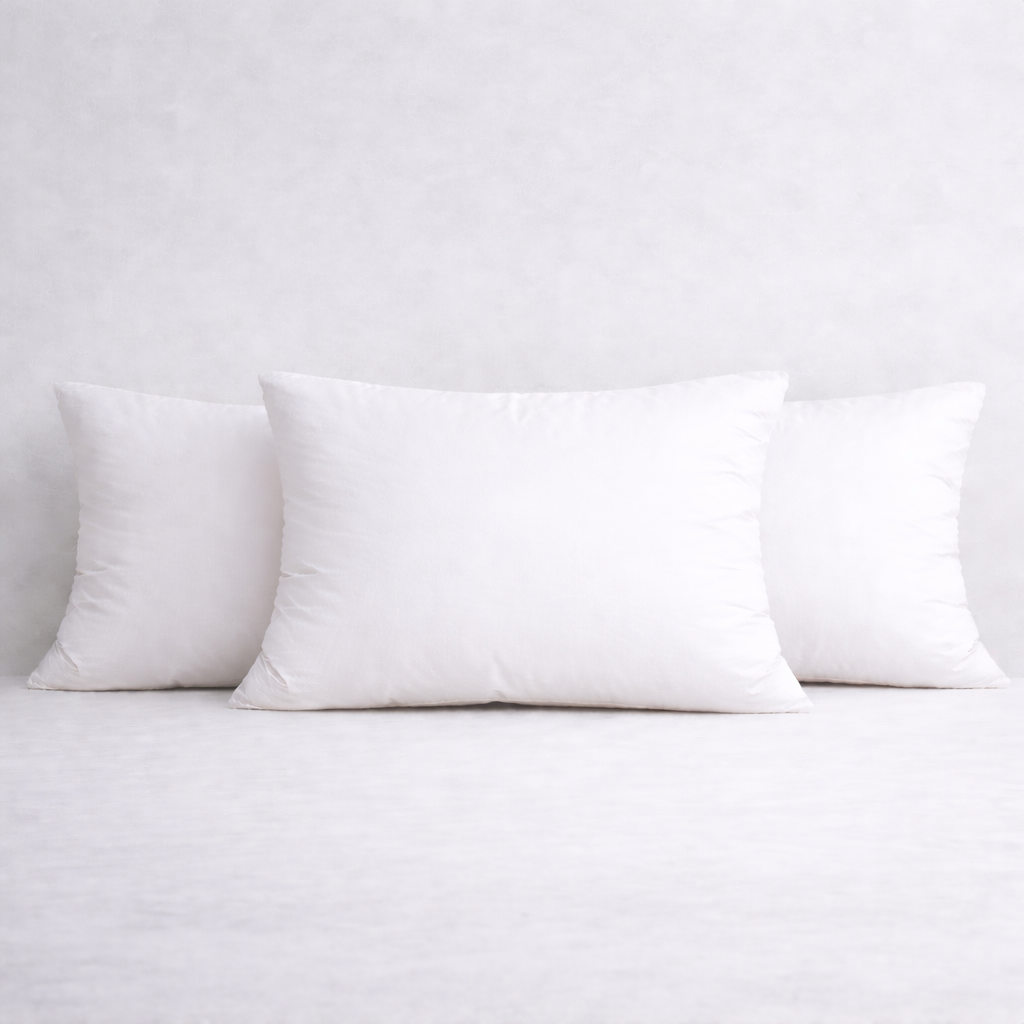 Set of three 14 x 20 inch rectangular feather cushion inserts on a pale neutral background, soft and plump finish.