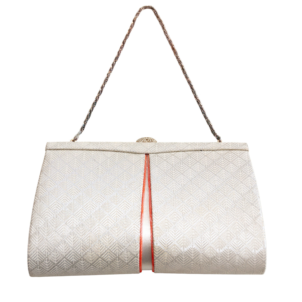 Vintage Japanese silk clutch bag in white and silver with orange accent and silver chain strap, geometric pattern.