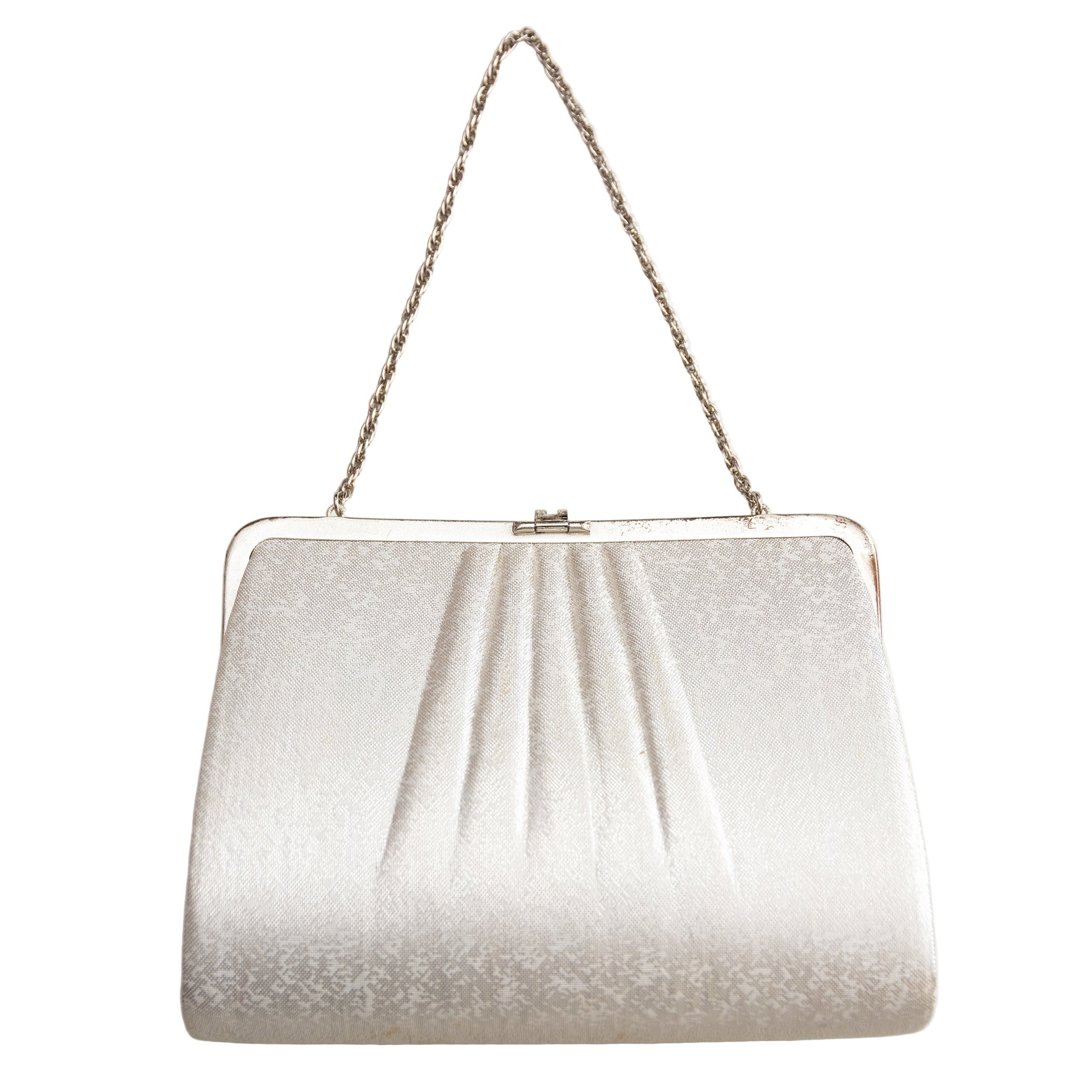 Reverse of the vintage Japanese silk clutch bag in textured ivory silk, white metal frame and chain strap